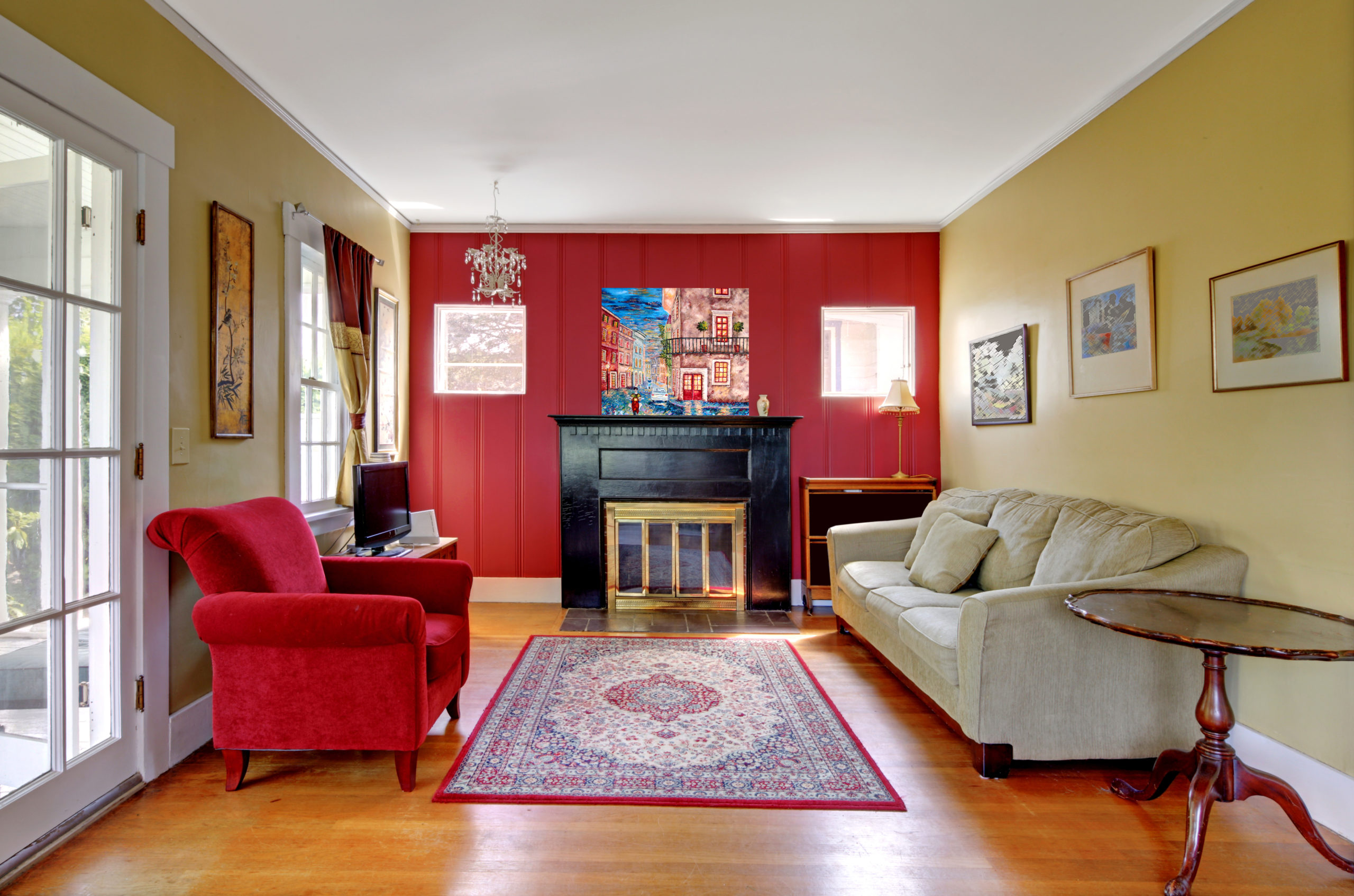 Living,Room,With,Red,And,Yellow,Walls,And,Fireplace,In
